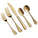 A five-piece set of gold-colored stainless steel flatware including two forks, a knife, and two spoons.