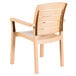 A white plastic Grosfillex Acadia Teakwood Classic stacking armchair with a backrest.