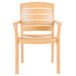 A Grosfillex tan plastic armchair with a teakwood design.