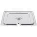 A Vollrath stainless steel slotted cover on a metal tray.