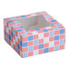 A square bakery box with a patriotic red, white, and blue USA-themed print and a clear window on top.