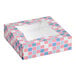 A square bakery box with a patriotic red, white, and blue USA flag print and a clear window on top.