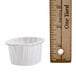 A Solo paper souffle cup next to a ruler.