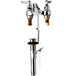 A T&S chrome deck mount medical faucet with two wrist action handles.