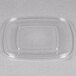 A clear plastic rectangle lid on a clear plastic container.