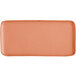 A rectangular, matte, terra cotta-colored platter with rounded edges.