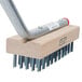 A FMP metal broiler and grill cleaning brush with a wooden handle.