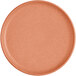 A round, terra cotta-colored plate with a matte finish and a slightly raised rim.