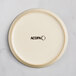A round, off-white plate with a matte finish and the word 'ACOPA' printed in black at the center.