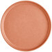 A round, terra cotta-colored plate with a matte finish and a slightly raised rim.