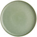 A round, sage green matte plate with a smooth, slightly raised rim.