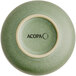 The image shows the bottom view of a small, round, sage green dish with a matte finish and the brand name 'ACOPA' printed on the base.