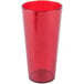 A stack of Carlisle ruby red plastic tumblers.