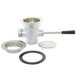 A T&S silver metal waste drain valve with a circular metal ring and a lever handle over a white round sink opening.