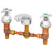 A T&S brass deck mount mixing faucet with two handles and pipes.