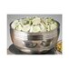 A Bon Chef triple wall bowl filled with cucumbers on a counter in a salad bar.