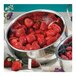 A Bon Chef double wall bowl filled with strawberries and raspberries on a table.