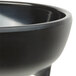 A black melamine Carlisle molcajete bowl with a handle.