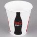 A white Solo paper cold cup with a black and red Coca-Cola logo.