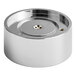 A round, metallic, chrome-colored component with a recessed center and a small hole in the middle, likely a mechanical or machine part.