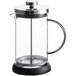 A clear glass French press with a metal lid, plunger, and handle, and a black base.