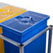 A metal stand with three clear plastic containers with blue and yellow lids.