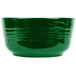 A green bowl with a white background and a handle.