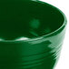 A close up of a green Tablecraft cast aluminum fruit bowl.