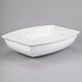 A white rectangular Tablecraft salad bowl with a handle.