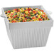 A Tablecraft natural cast aluminum square bowl filled with corn salad.