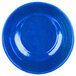 A blue plate with a speckled surface and a circle in the middle.