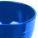 A close up of a Tablecraft blue speckle bowl.
