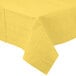 A yellow tablecloth with a white border.