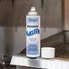 A white spray bottle of Noble Chemical Nukleen oven and grill cleaner on a counter.