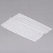 Durable Packaging interfolded wax paper on a white surface.