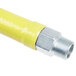 A close-up of a yellow T&S gas connector hose with silver NPT male ends.