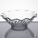 A clear glass Carlisle tulip berry dish with a rippled edge.