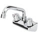 A Regency chrome wall mount bar sink faucet with two handles and a 6" swing spout.