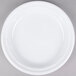 A Dart Famous Service white plastic plate on a gray surface.
