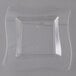 A clear plastic square plate with a curved edge.