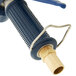 A T&S stainless steel pre-rinse water gun with a blue rubber cover and brass fittings.