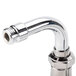 A T&S chrome plated wall mount pet grooming faucet with a hose.
