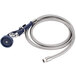 A blue hose with a metal nozzle attached to a T&S wall mount pet grooming faucet.