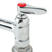 A T&S chrome deck mount pet grooming faucet with a red button on top.