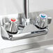 An Eagle Group stainless steel hand sink with gooseneck and wrist action faucets on a counter.