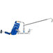 A T&S wall mount pet grooming faucet with a blue coiled hose attached.
