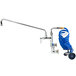 A T&S wall mount pet grooming faucet with a blue coiled hose.