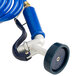 A blue hose with a metal nozzle and a blue and silver tool.