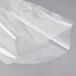 A clear plastic wrapper on a gray surface with ARY VacMaster 14" x 24" Chamber Vacuum Packaging Bags inside.