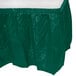 A hunter green plastic table skirt with a white top.